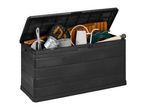 Black garden storage box with an open lid, filled with a green hose, watering can, and other gardening tools.