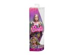 A Barbie doll in a floral dress, packaged in a clear plastic box with purple and pink accents.