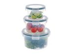 Stack of three round food storage containers with limes, tomatoes, and lettuce.