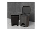 Two dark grey plastic bins, one with a lid open and a foot pedal, on a tiled floor.