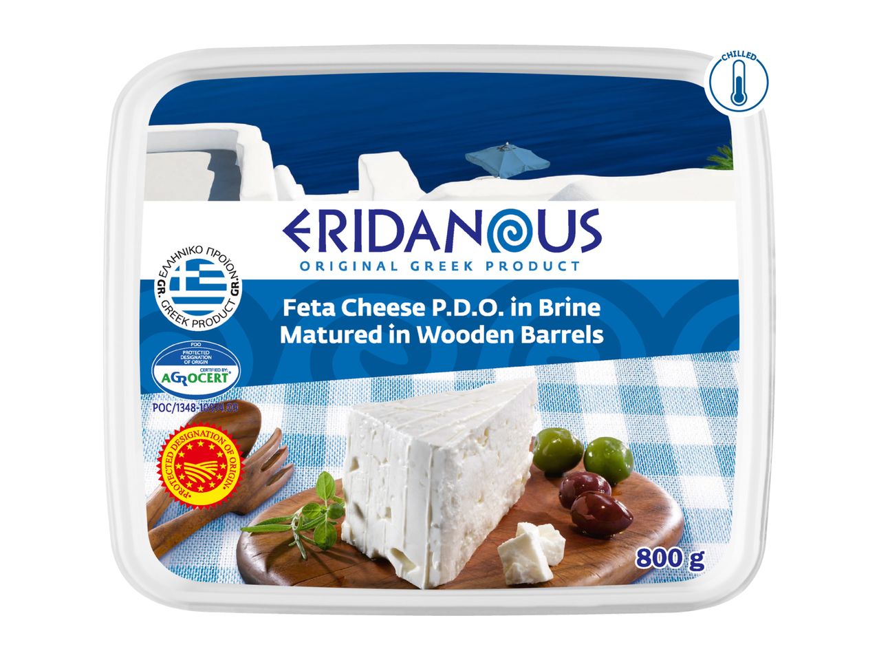 Feta cheese in brine, matured in wooden barrels, with olives and herbs on a wooden board.