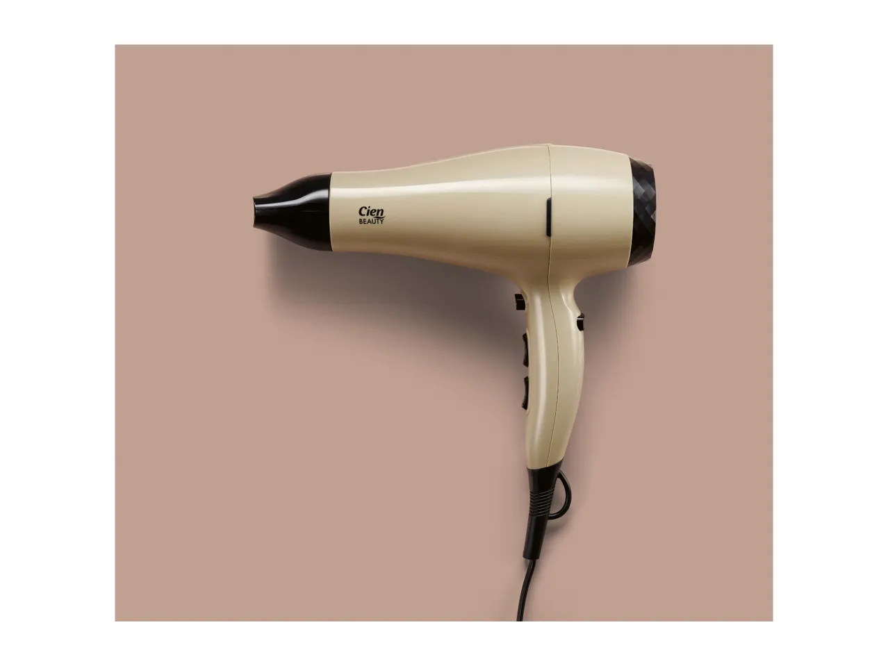 A beige and black hair dryer with the brand name Cien Beauty on it, against a light brown background.