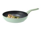 Light green frying pan with a speckled black interior, containing cooked salmon and vegetables.