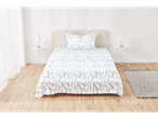 A bed with white sheets featuring a gray pattern, two nightstands, and a rug in a room.