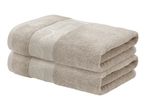 Two folded beige towels with a decorative patterned band.
