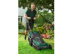 Man mowing lawn with a Parkside 1800W Electric Lawnmower in a garden.