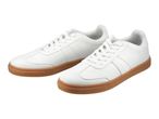 Pair of white sneakers with brown soles