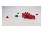 Two red gift boxes with gold bows and scattered decorative bows on a wooden surface.