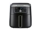 Black air fryer with digital display showing 180°C and various cooking functions.