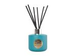 Teal reed diffuser with gold label reading Moonlit Blooms