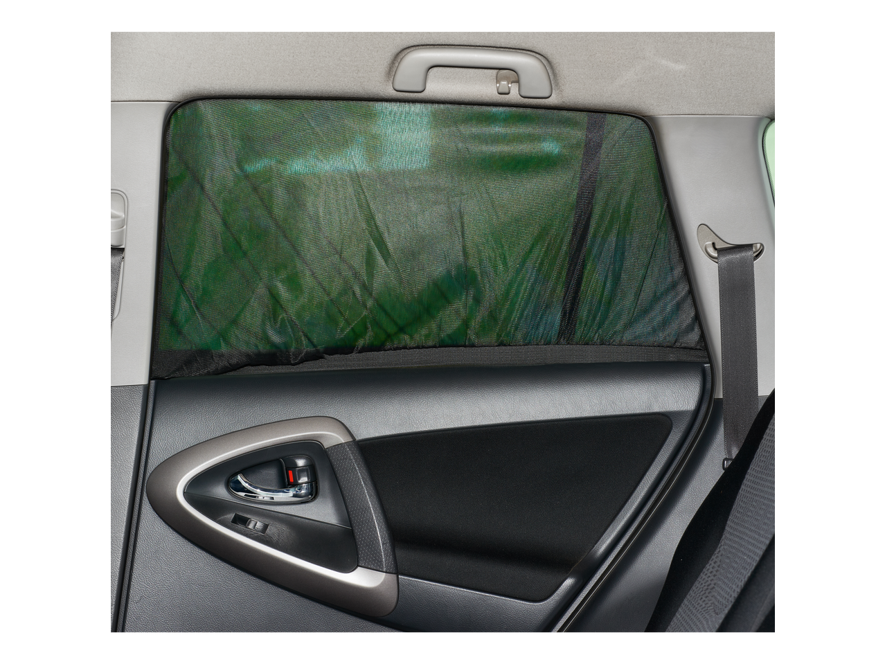 Car window sun shade with a view of the car's interior door panel and seatbelt.
