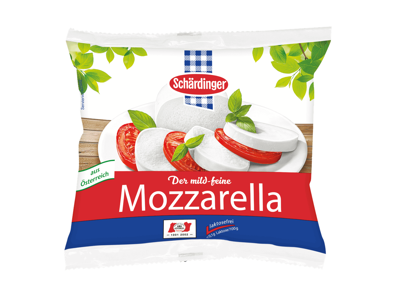 Schärdinger Mozzarella, laktosefrei, mit Tomaten und Basilikum auf einem Teller.