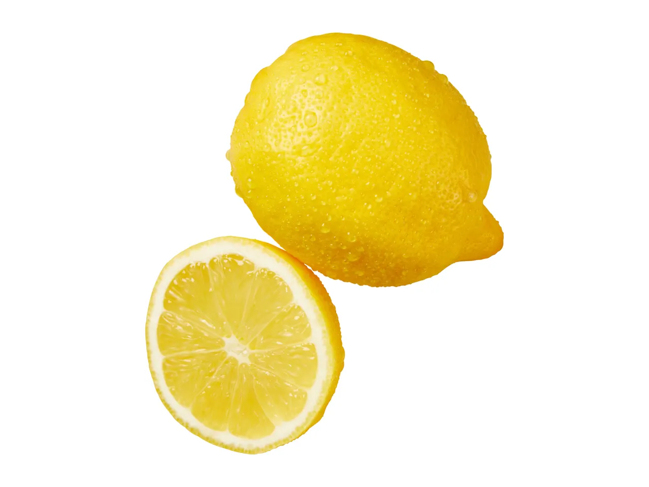 A whole fresh lemon with water droplets next to a cut lemon half.