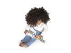 Child playing with a white and wooden toy guitar with colorful animal buttons.