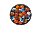 A bowl of Halloween-themed chocolates, including foil-wrapped eyeballs and pumpkin designs.
