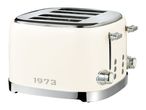 Cream-colored retro 4-slice toaster with chrome details and '1973' lettering