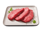 Drei rohe Rindersteaks mit Petersilie und Gewürzen auf einer grauen Platte.