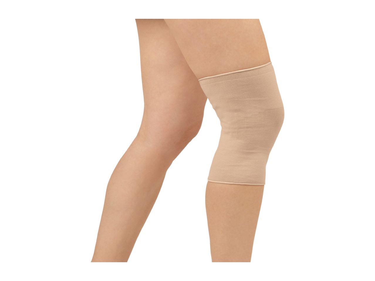 A person's legs with a beige knee support on one knee
