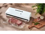SILVERCREST® Vacuum Sealer with meat, garlic, rosemary, and peppercorns on a wooden board.