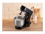 Black stand mixer with a stainless steel bowl of whipped cream on a wooden counter.