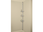 LIVARNO home Extendable Bathroom Caddy with three shelves and bottles in a corner.