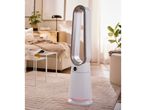 White and grey bladeless fan in a modern living room with a bed and side tables.