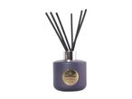 Reed diffuser in a purple bottle with gold label and black reeds