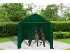 Green tent garage with bicycles and electric scooter on a concrete path.