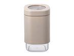 Beige and clear plastic spice jar with a square base and rounded corners.