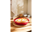 SILVERCREST® silicon baking assortment with cake, wooden spoon, and powdered sugar.