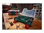 Open and closed organizer boxes with screws and wall plugs on a wooden workbench.