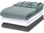 Livarno Jersey Fitted Sheets in green, white, and grey, stacked neatly.