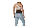 Woman from behind wearing a light grey sports bra, black waist trimmer, and light blue leggings.