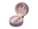 A purple velvet round jewelry box is open, revealing compartments for rings and earrings.