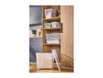 Transparent plastic storage boxes with lids on wooden shelves and on the floor.