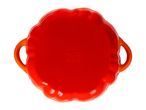 Top-down view of a red, round casserole dish with handles, featuring a brand logo and symbols on the bottom.