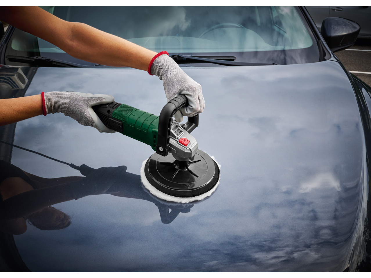 PARKSIDE® 1200W Electric Polisher used on a car hood.
