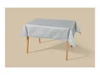 Table with a light blue tablecloth featuring a subtle leaf pattern.