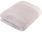 Couverture tricotée beige clair pliée