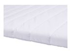Close-up of a white quilted mattress topper
