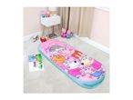 Pink sleeping bag with cartoon characters, surrounded by toys and a bedside table.