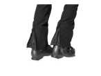CRIVIT women's softshell ski pants with leg zippers, worn over ski boots.