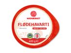 Rund beholder med flødehavarti, mærket 'Mild 60+ | 38% fedt' og '400 ge'.