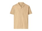 Men's short-sleeved collared shirt in a light beige color with a textured fabric.