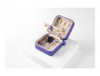 A purple travel jewelry case with various compartments open, showcasing its contents.