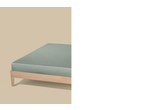 Cama com colchão verde claro sobre um fundo bege.