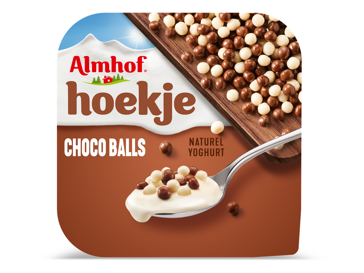 Yoghurt met chocoladeballetjes op een lepel.