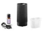 Set difuzor de aromă ultrasonic LIVARNO home cu ulei esențial, pahar de măsurare și cablu USB.