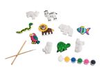 A craft kit with animal-shaped plaster figures, paints, and brushes.