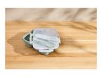 Collapsible lunch box with cutlery on a wooden table
